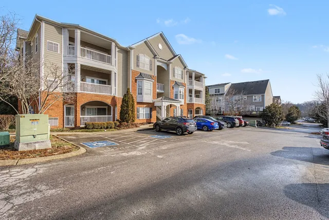 a view of a street with a building in the background