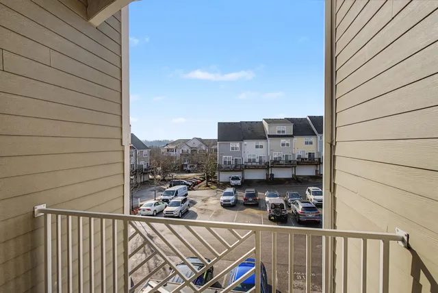 a view of a balcony with furniture