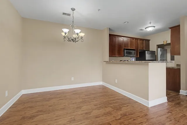 a view of a kitchen with a sink and dishwasher