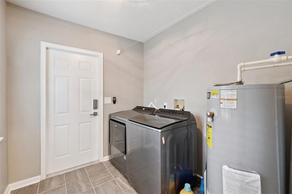 1304 Perkins Road Orlando, FL 32809 - Photo 18 of 22 a utility room with dryer and washer