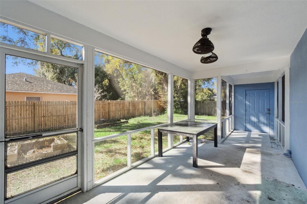 1304 Perkins Road Orlando, FL 32809 - Photo 19 of 22 a room with lots of furniture and large windows
