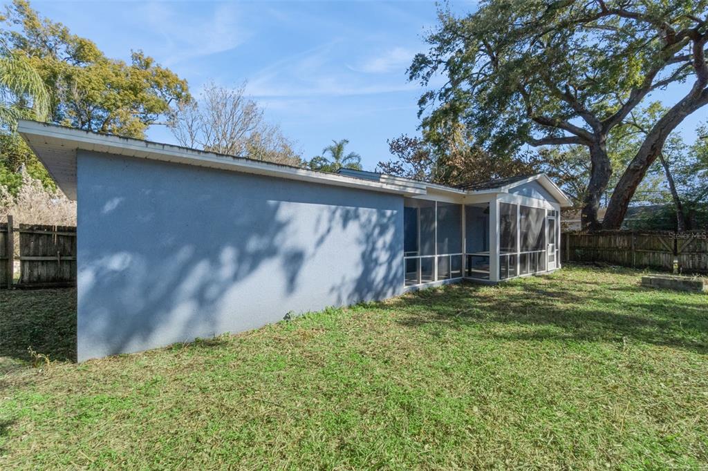1304 Perkins Road Orlando, FL 32809 - Photo 21 of 22 a view of a house with a yard