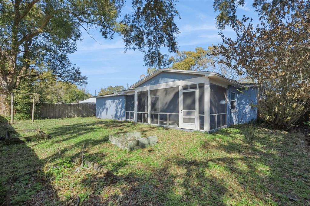 1304 Perkins Road Orlando, FL 32809 - Photo 22 of 22 a view of a house with a yard