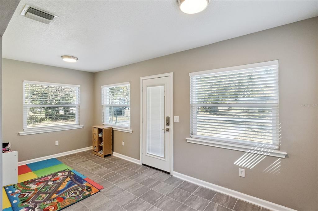 1304 Perkins Road Orlando, FL 32809 - Photo 4 of 22 a view of an empty room with a window
