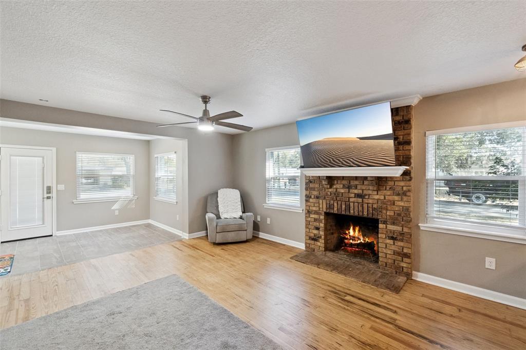 1304 Perkins Road Orlando, FL 32809 - Photo 5 of 22 a living room with furniture and a fireplace