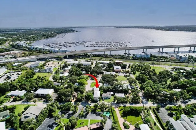 an aerial view of a house with a yard