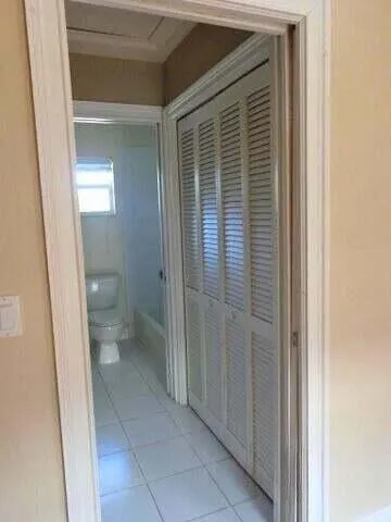 a kitchen with sink cabinets and window