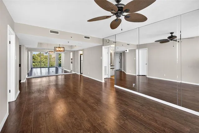 a view of an entryway with wooden floor
