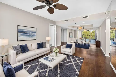 a kitchen with stainless steel appliances granite countertop a sink a stove and a microwave