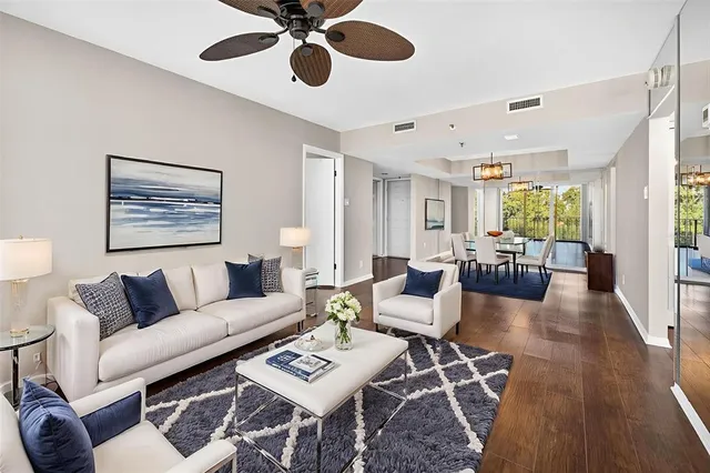 a kitchen with stainless steel appliances granite countertop a sink a stove and a microwave