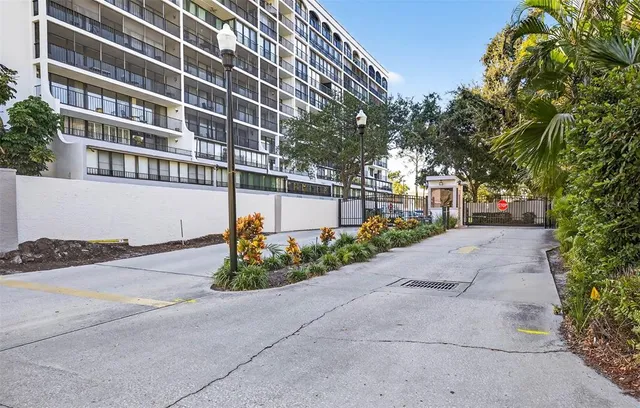 a view of a street with a building in the background
