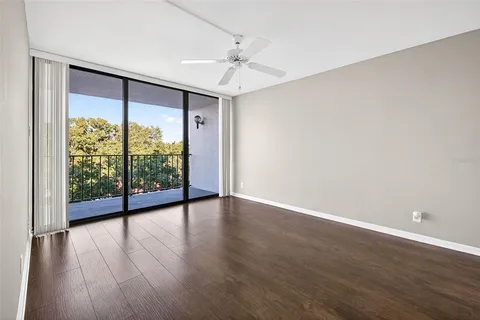 a large bedroom with a large bed and a window