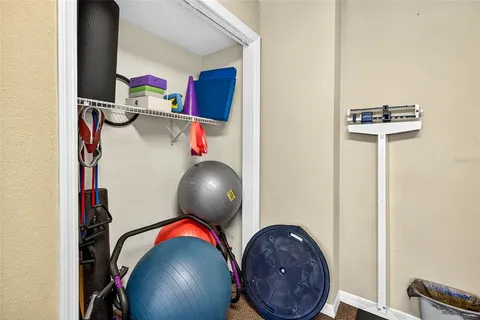 swimming pool view with a seating space