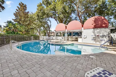 a view of a swimming pool with a patio