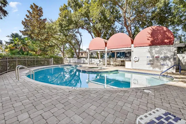 a view of a swimming pool with a patio