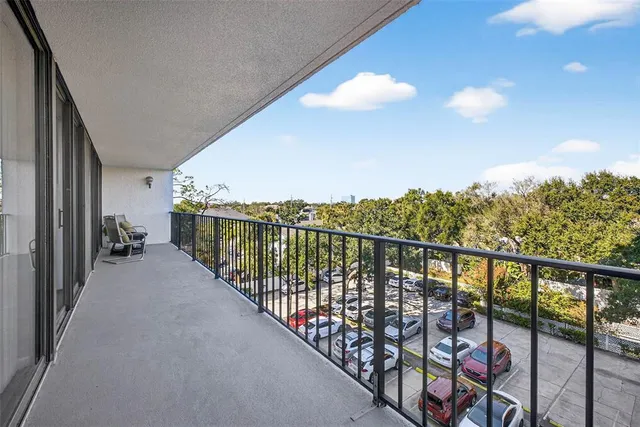 a view of a balcony with furniture