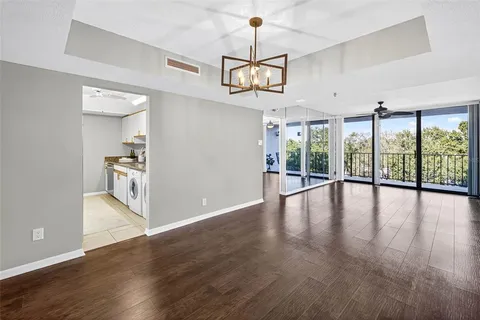 a view of an entryway with wooden floor