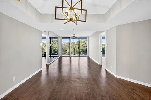 a view of a room with wooden floors and natural light