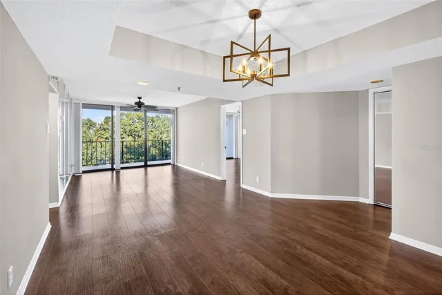 a view of a hallway view with wooden floor and entryway