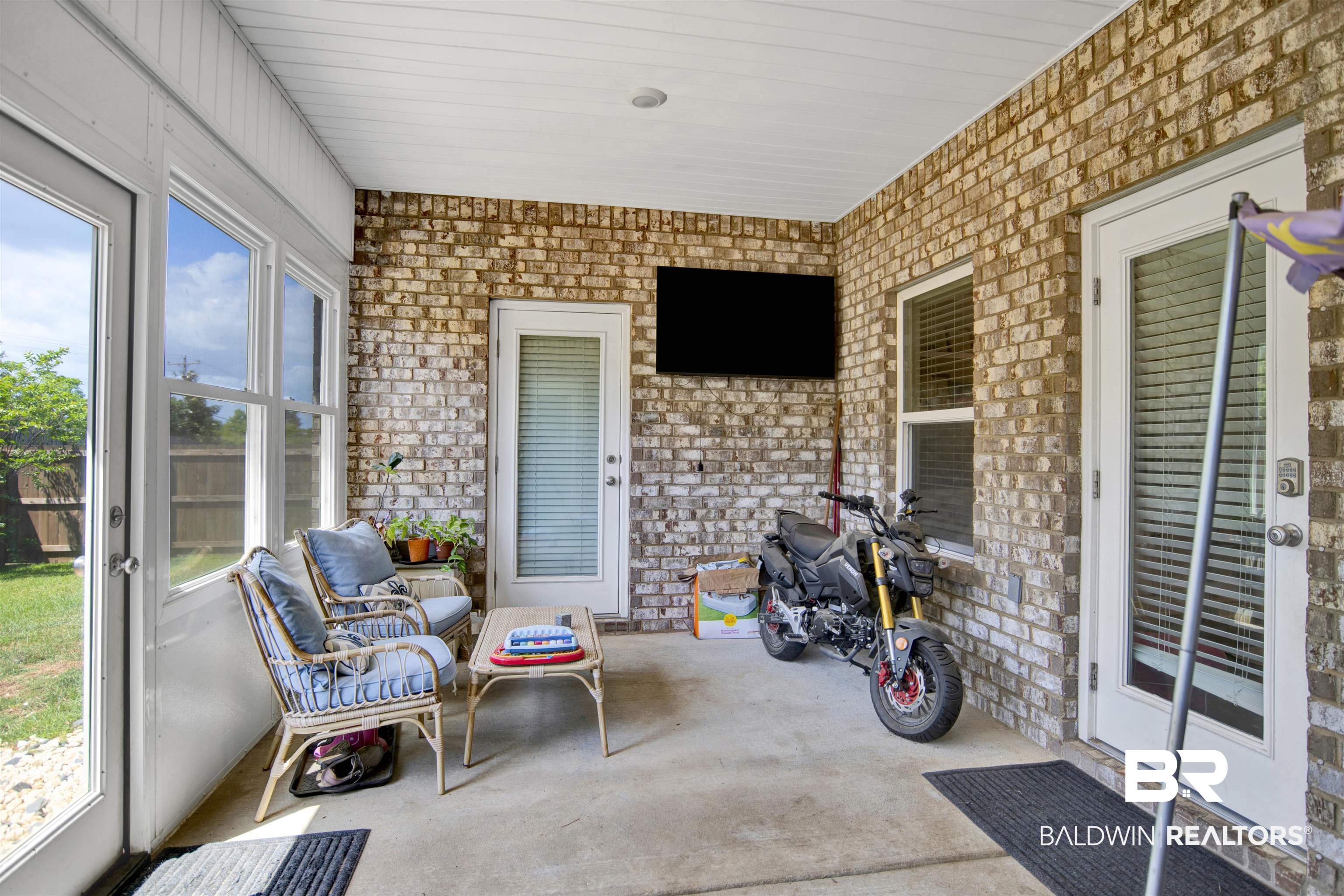 8669 Bronze Lane Foley, AL 36535 - Photo 27 of 28 Enclosed Back Porch