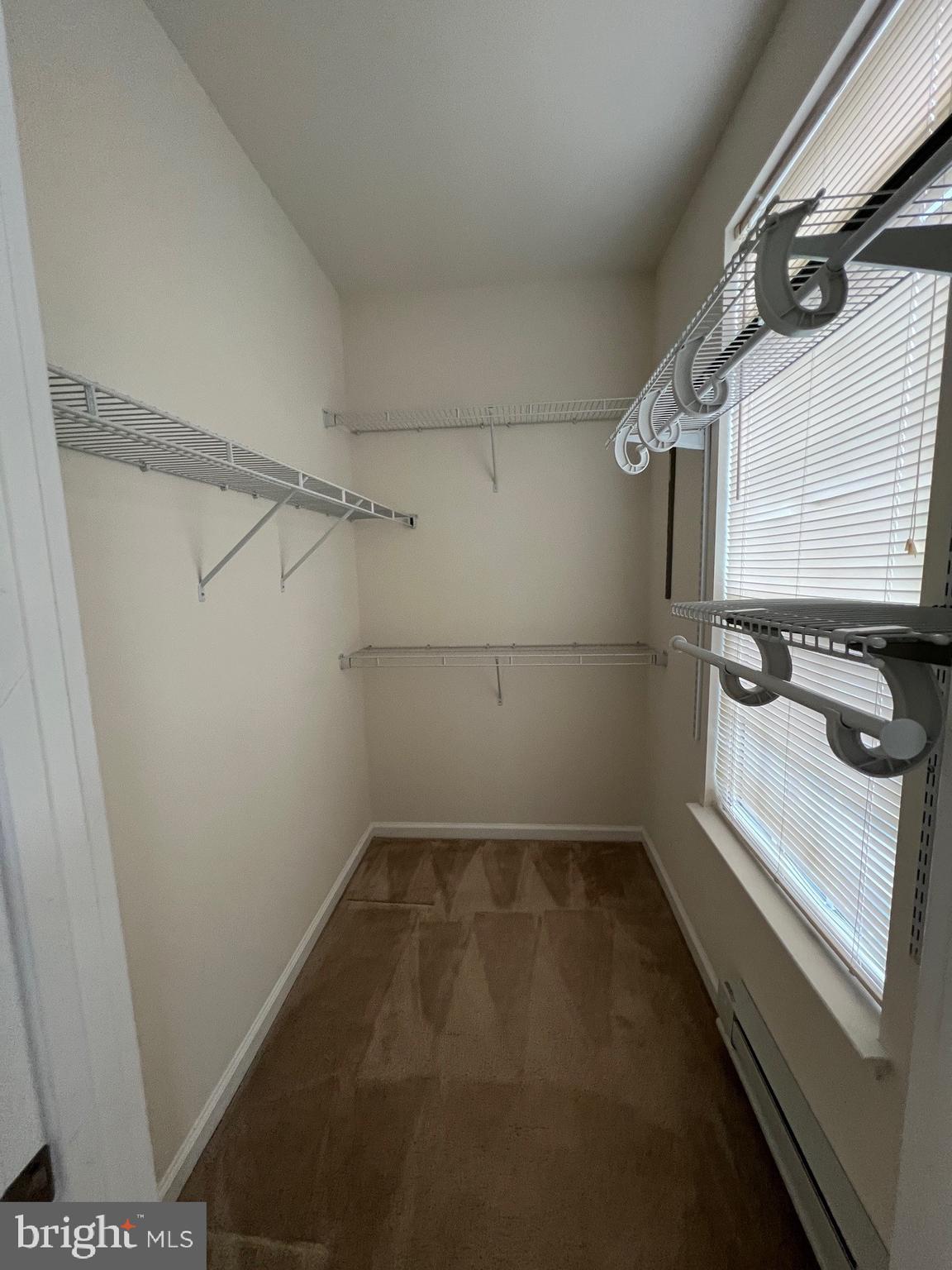 5057 Small Gains Way Frederick, MD 21703 - Photo 13 of 22 a view of a room with racks on the wall