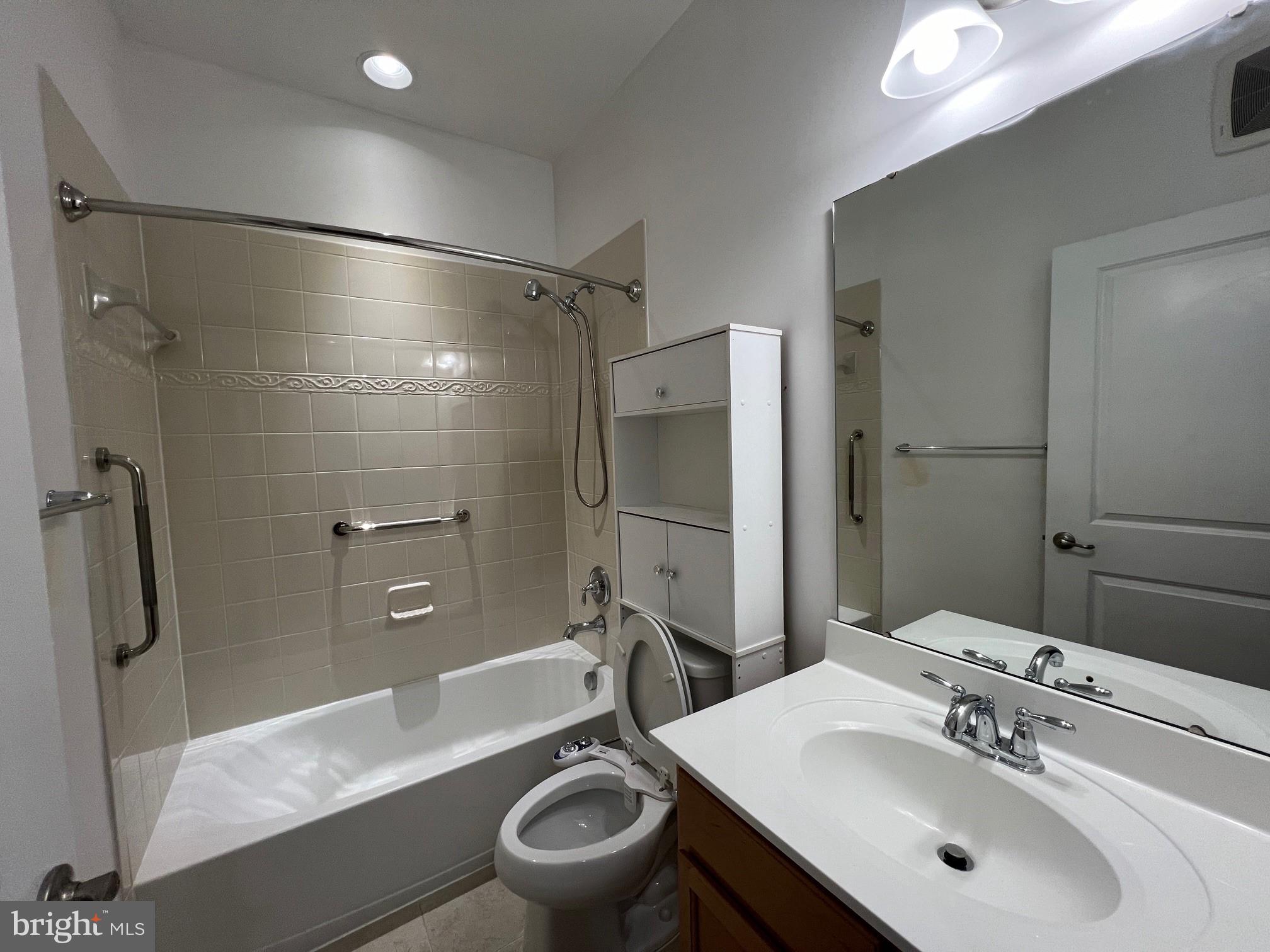5057 Small Gains Way Frederick, MD 21703 - Photo 17 of 22 a bathroom with a sink toilet and shower