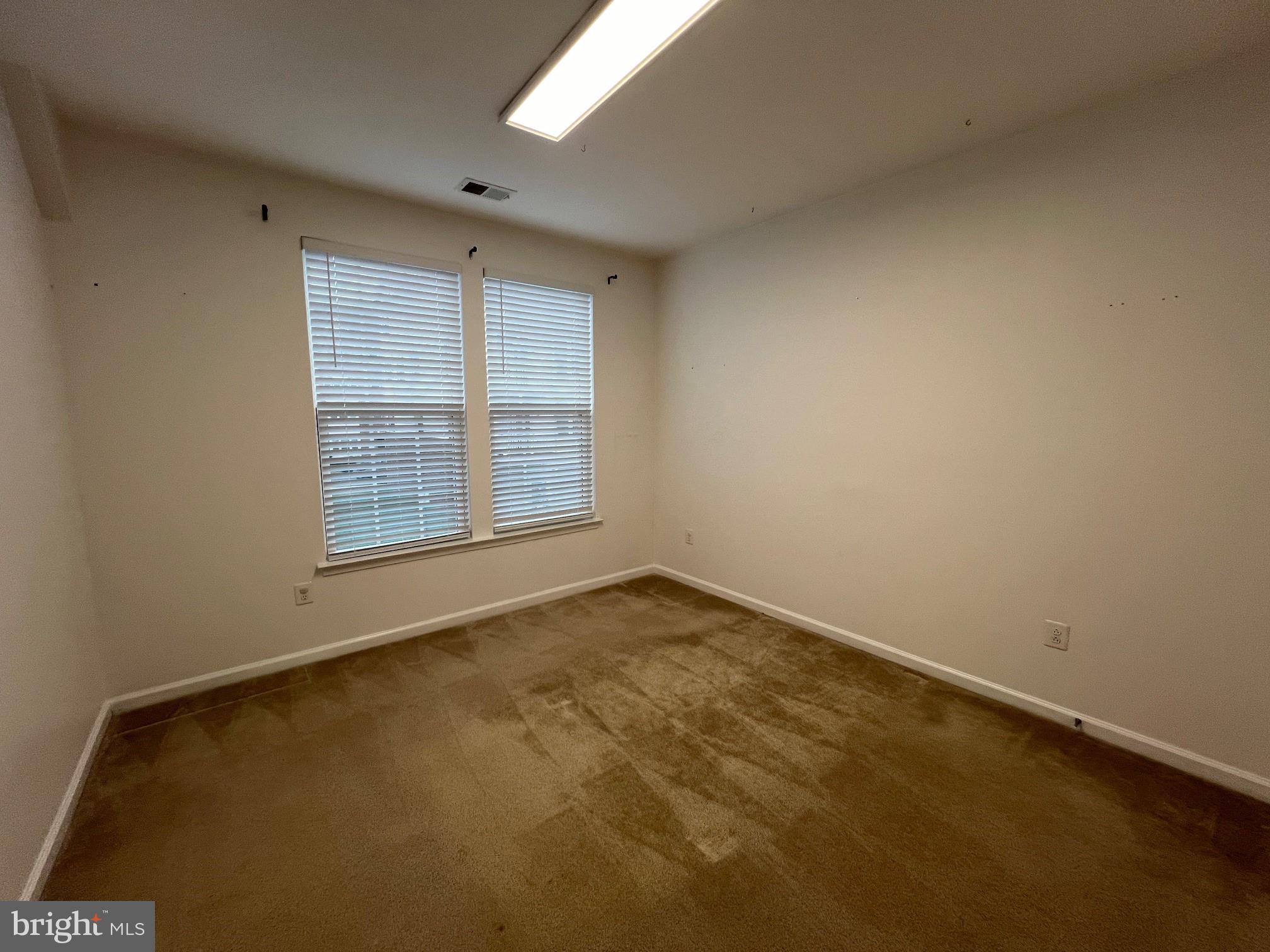 5057 Small Gains Way Frederick, MD 21703 - Photo 19 of 22 an empty room with windows