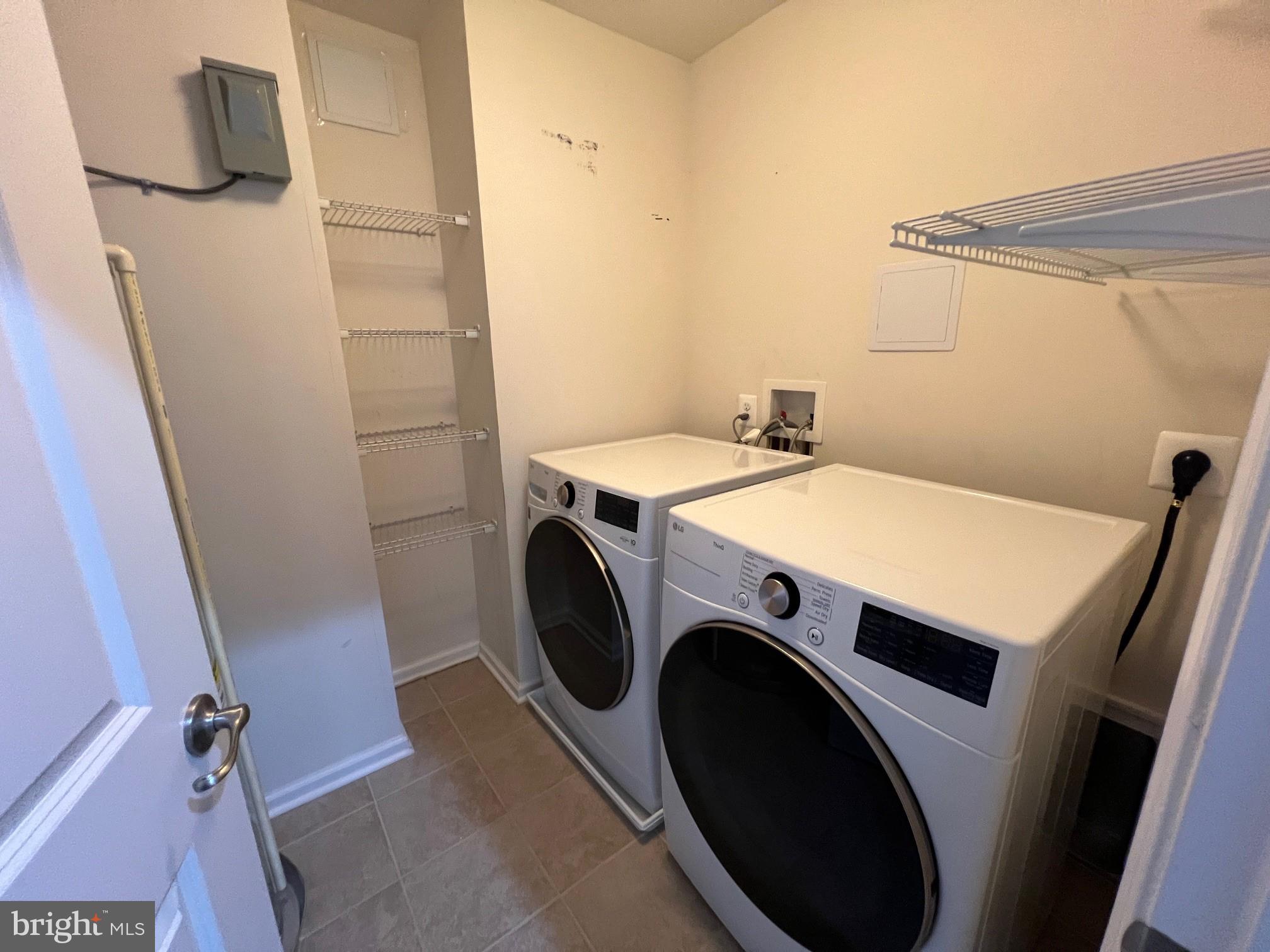 5057 Small Gains Way Frederick, MD 21703 - Photo 20 of 22 a utility room with dryer and washer