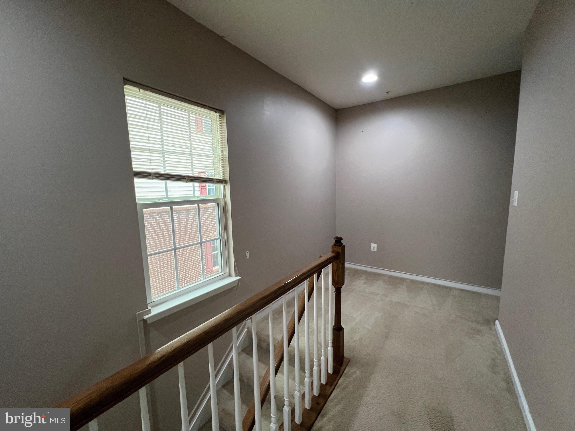 5057 Small Gains Way Frederick, MD 21703 - Photo 8 of 22 an empty room with windows