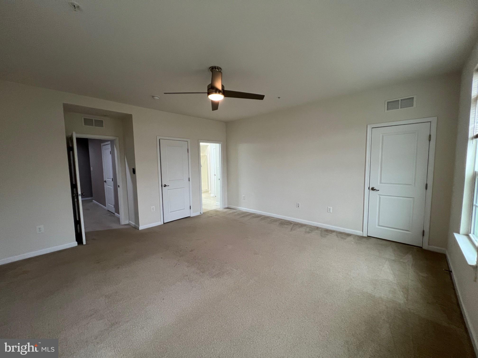 5057 Small Gains Way Frederick, MD 21703 - Photo 9 of 22 a view of an empty room with a window