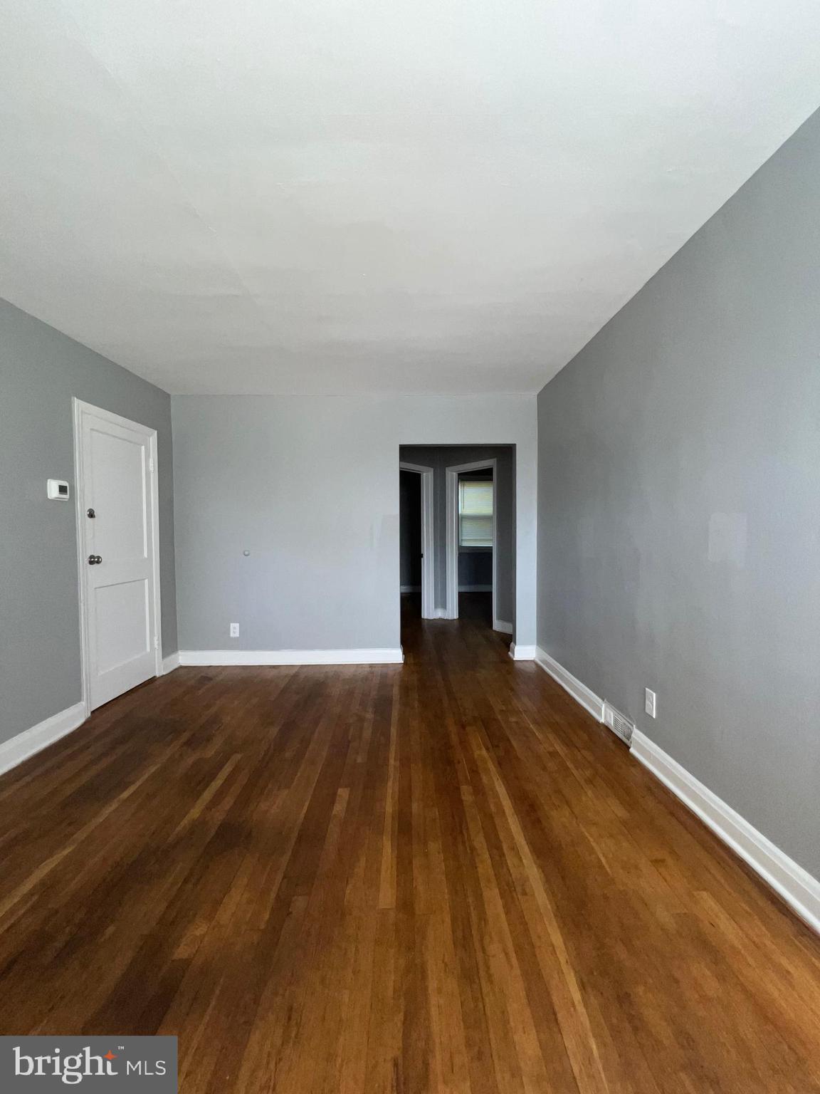 1128 Gleneagle Road Baltimore, MD 21239 - Photo 7 of 21 a view of an empty room and window