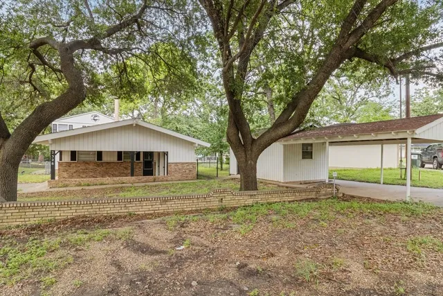 a house with trees in the background