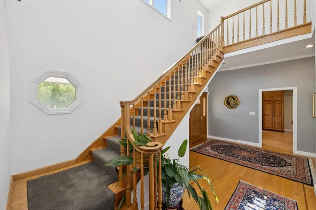 a view of an entryway with wooden floor