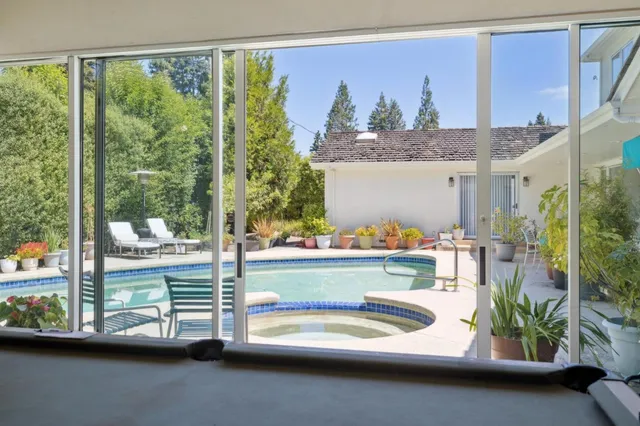 a front view of a house with outdoor seating space