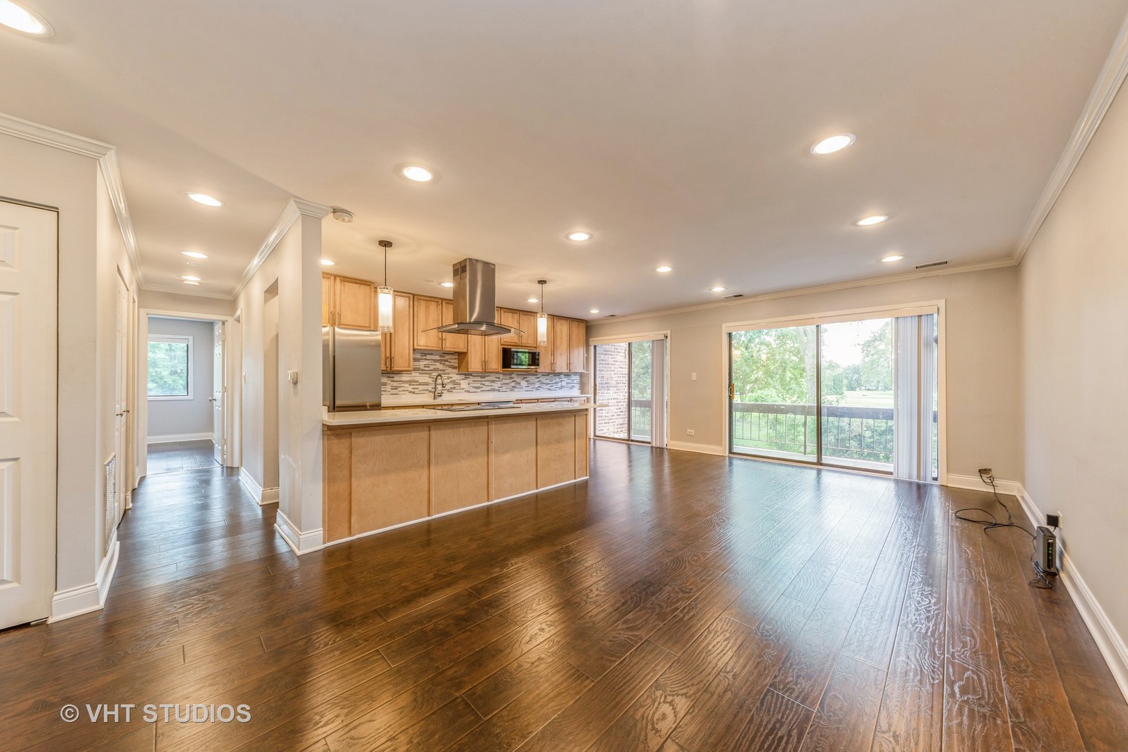 1400 North Elmhurst Road, Unit 219 Mount Prospect, IL 60056 - Photo 2 of 10 a view of a kitchen with a sink and wooden floor