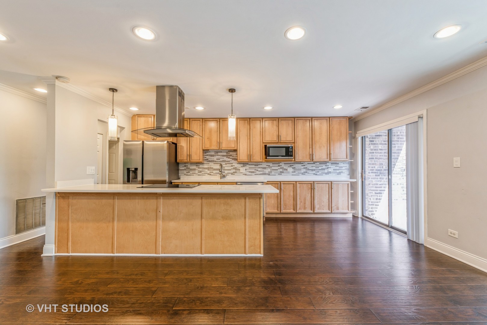 1400 North Elmhurst Road, Unit 219 Mount Prospect, IL 60056 - Photo 4 of 10 a large kitchen with stainless steel appliances granite countertop a large counter top a sink a refrigerator and a counter top space