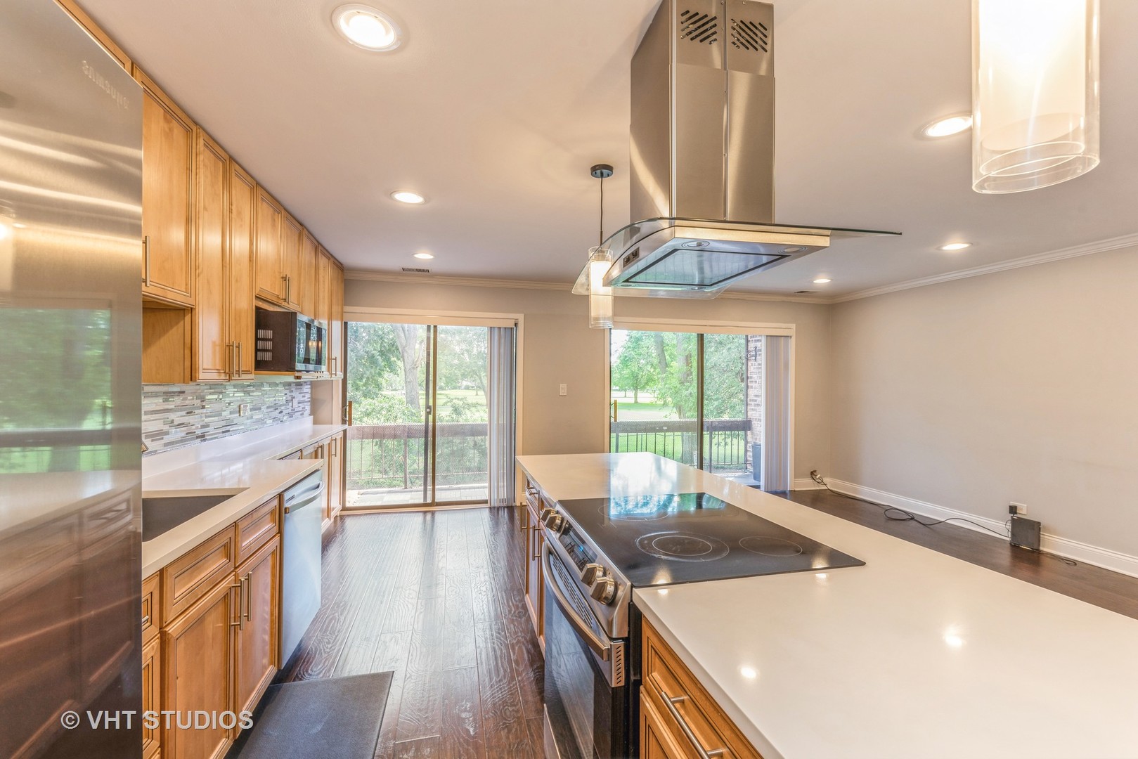 1400 North Elmhurst Road, Unit 219 Mount Prospect, IL 60056 - Photo 5 of 10 a kitchen with stainless steel appliances granite countertop a sink and a wooden floors