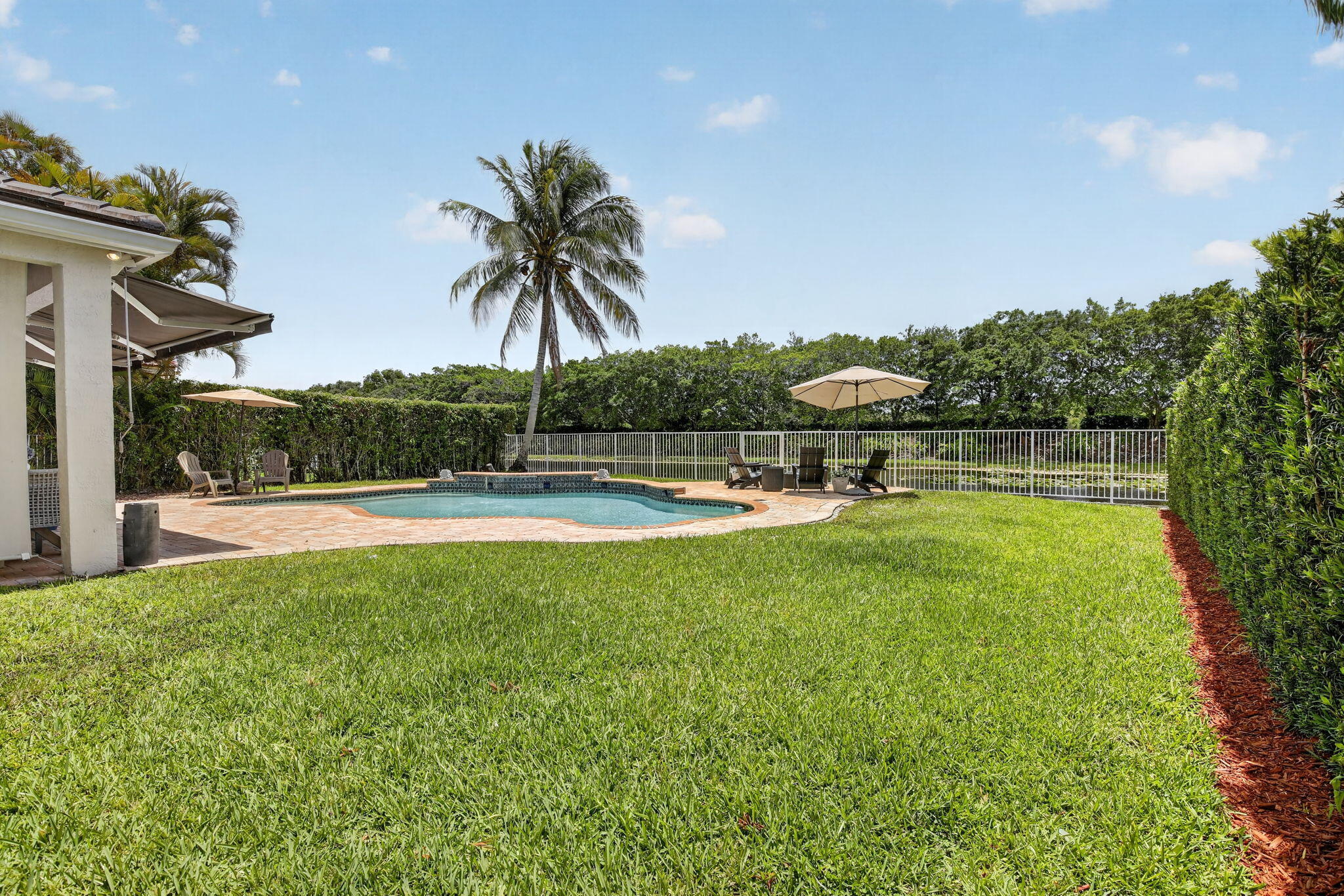 4299 Laurel Ridge Circle Weston, FL 33331 - Photo 75 of 103 a view of swimming pool with outdoor seating and plants
