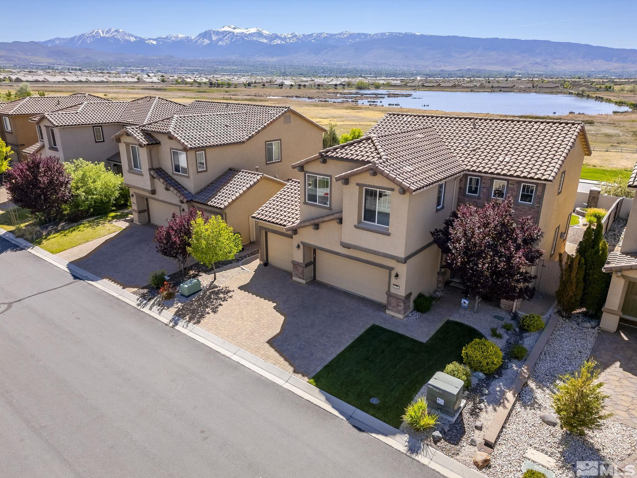 2795 Show Jumper Lane Reno, NV 89521 - Photo 3 of 37 an aerial view of a house with a swimming pool patio and outdoor seating