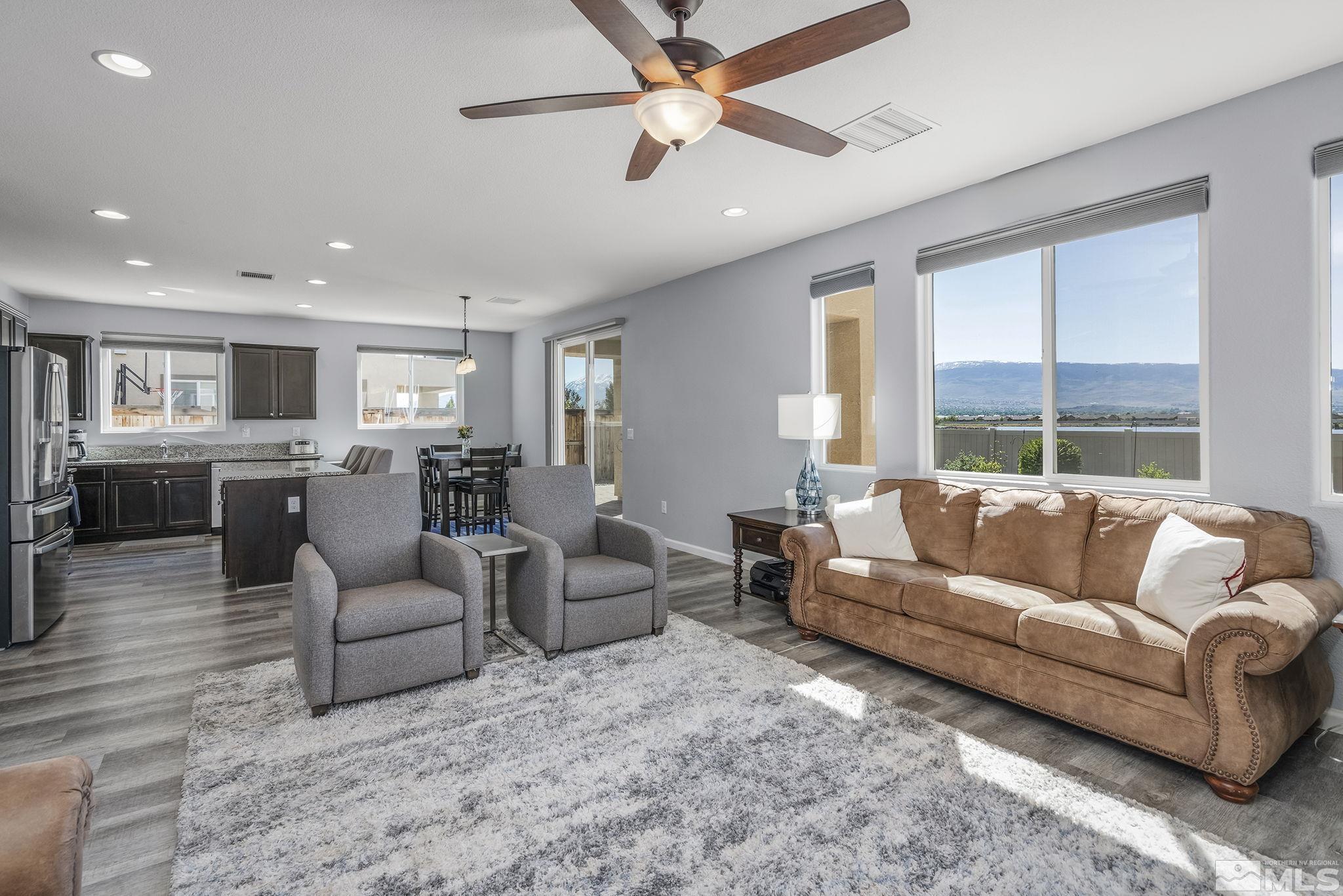 2795 Show Jumper Lane Reno, NV 89521 - Photo 8 of 37 a living room with furniture and a large window