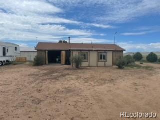 8246 Manitou Springs Road Blanca, CO 81123 - Photo 1 of 24 a view of a house with a backyard