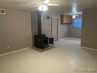 8246 Manitou Springs Road Blanca, CO 81123 - Photo 23 of 24 a view of an empty room with a chandelier fan