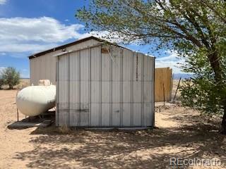 8246 Manitou Springs Road Blanca, CO 81123 - Photo 5 of 24 a backyard of a house with a tree
