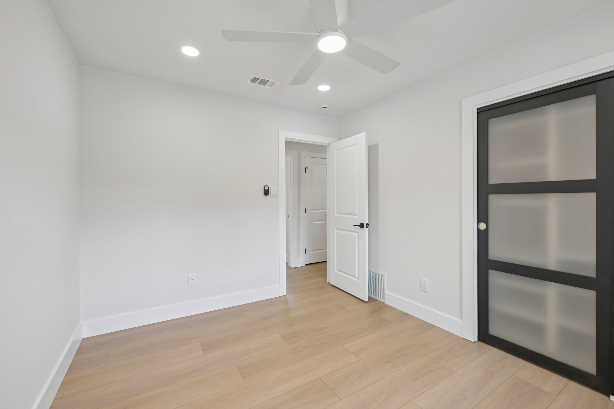 11809 Charing Cross Road Austin, TX 78759 - Photo 24 of 33 a view of an empty room with a kitchen