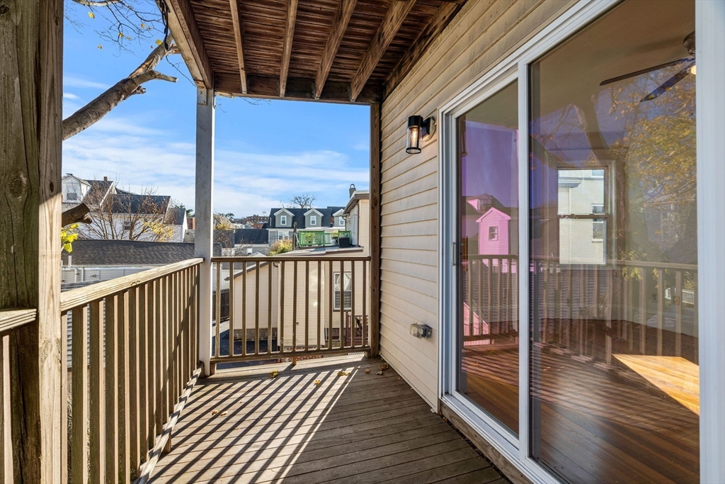 372 Adams Street, Unit 2 Boston, MA 02122 - Photo 17 of 20 a view of a balcony with wooden floor