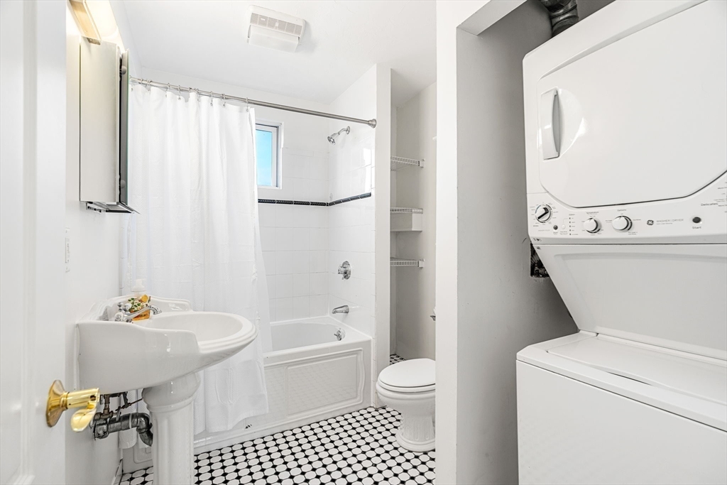 372 Adams Street, Unit 2 Boston, MA 02122 - Photo 9 of 20 a bathroom with a sink toilet and shower