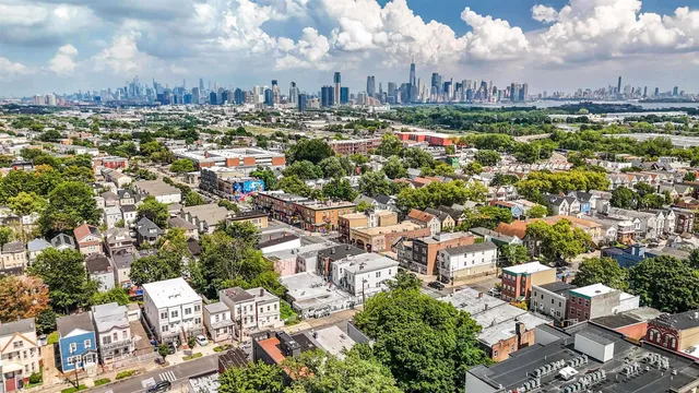 an aerial view of residential houses with yard
