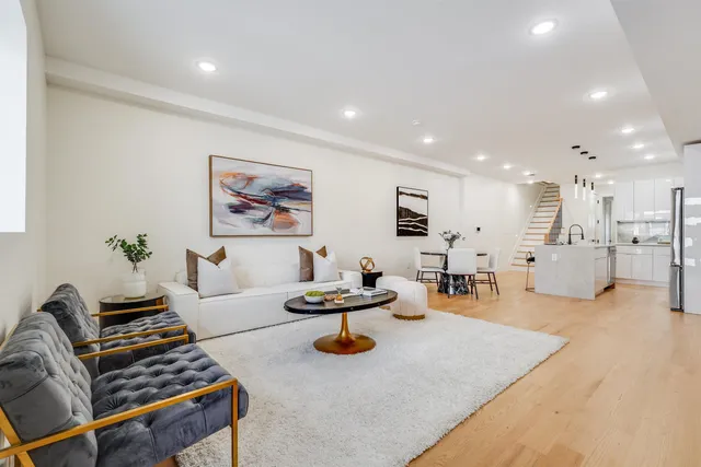 a living room with furniture and a table