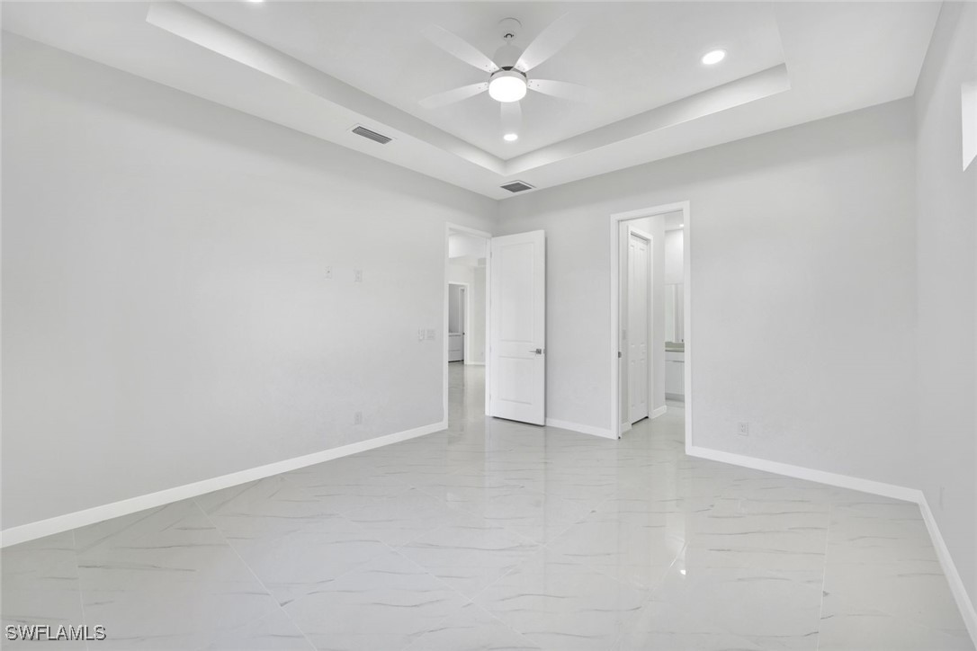 347 Ranch Avenue Lehigh Acres, FL 33974 - Photo 15 of 30 wooden floor in an empty room