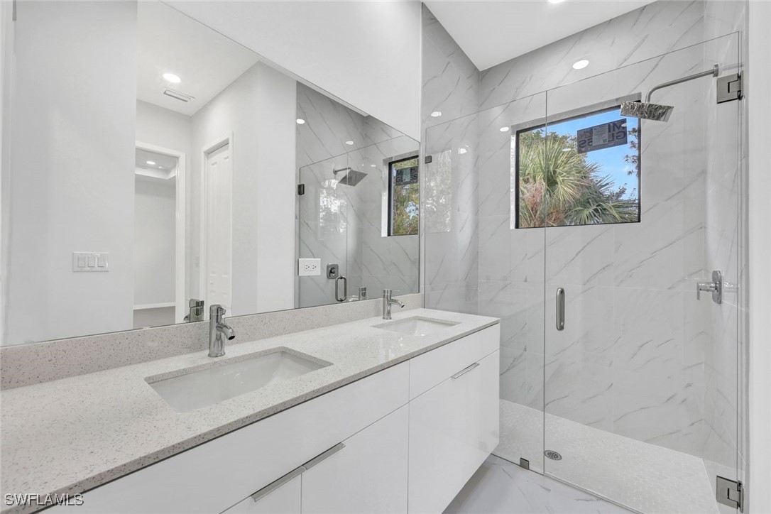 347 Ranch Avenue Lehigh Acres, FL 33974 - Photo 18 of 30 a bathroom with a double vanity sink mirror and double
